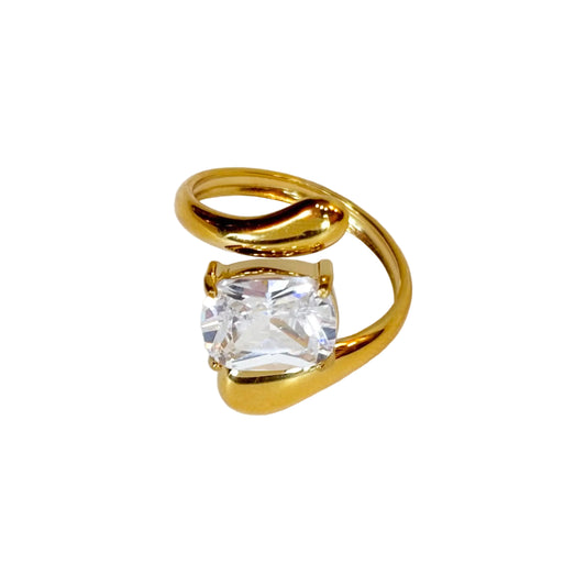 Gold ring with a diamant gemstone on a white background