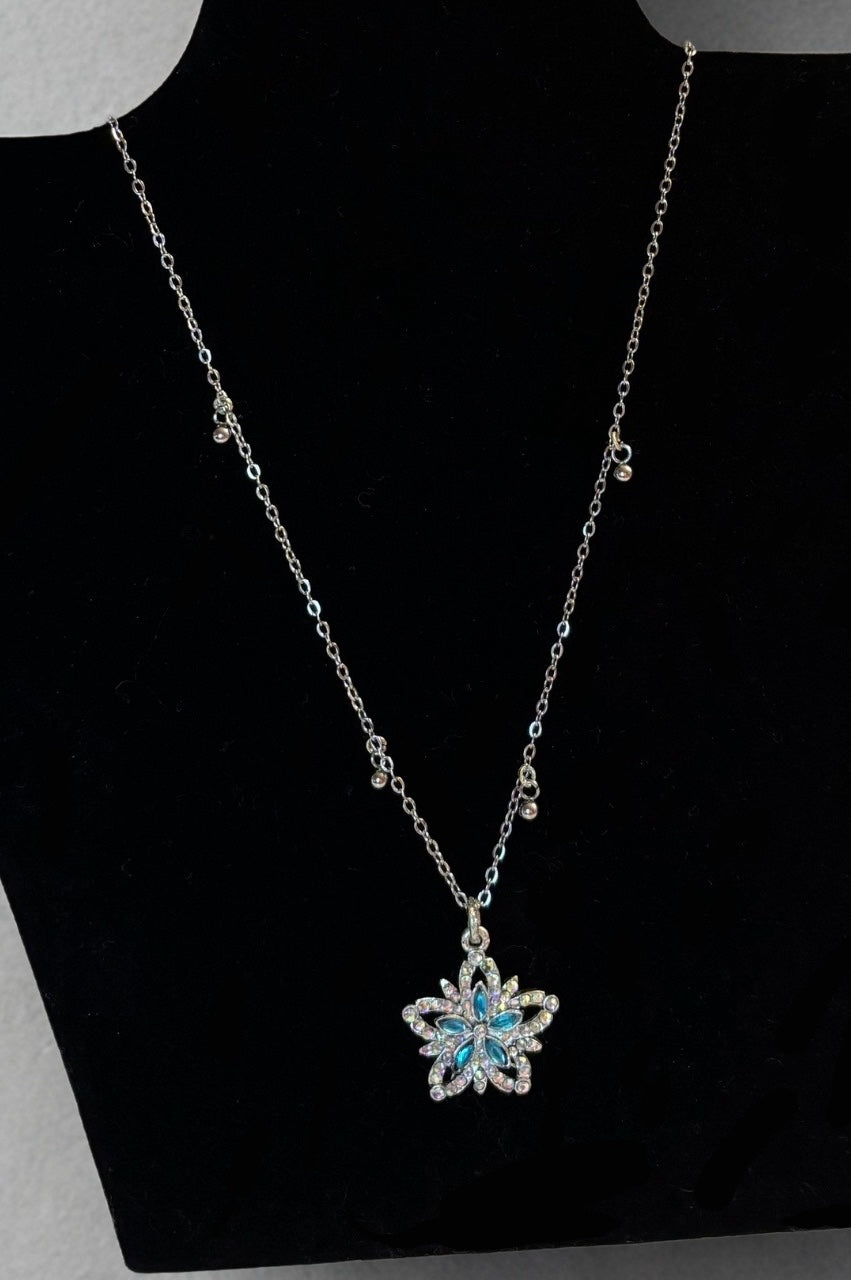 Fairydust halo silver necklace white backround on a stand