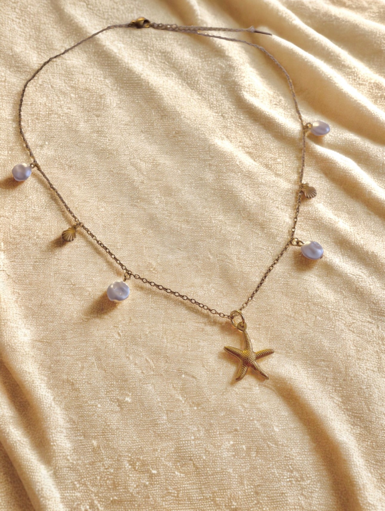 the Ocean Breeze stainless steel necklace – flat on a surface - ideal for summer looks