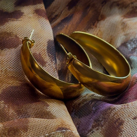 Eternal 18k Gold-Plated Hoops Earrings on geometric backround 