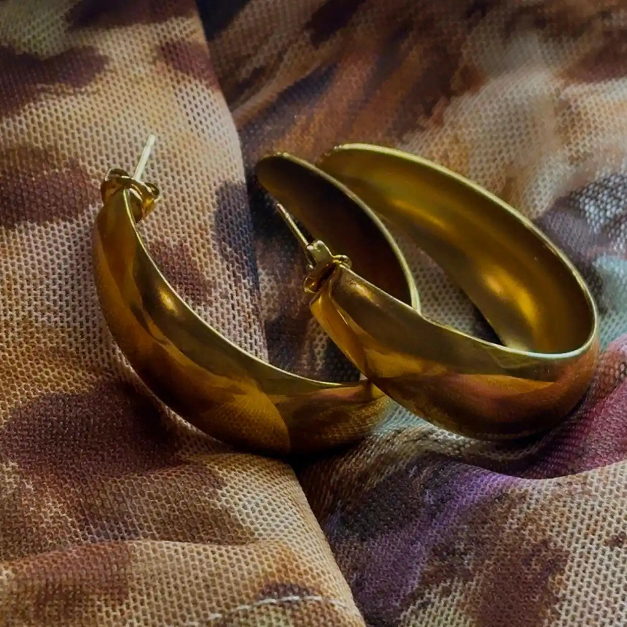 Eternal 18k Gold-Plated Hoops Earrings on geometric backround 