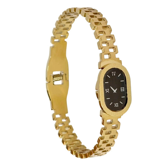 Gold bracelet watch with a black face on a white background