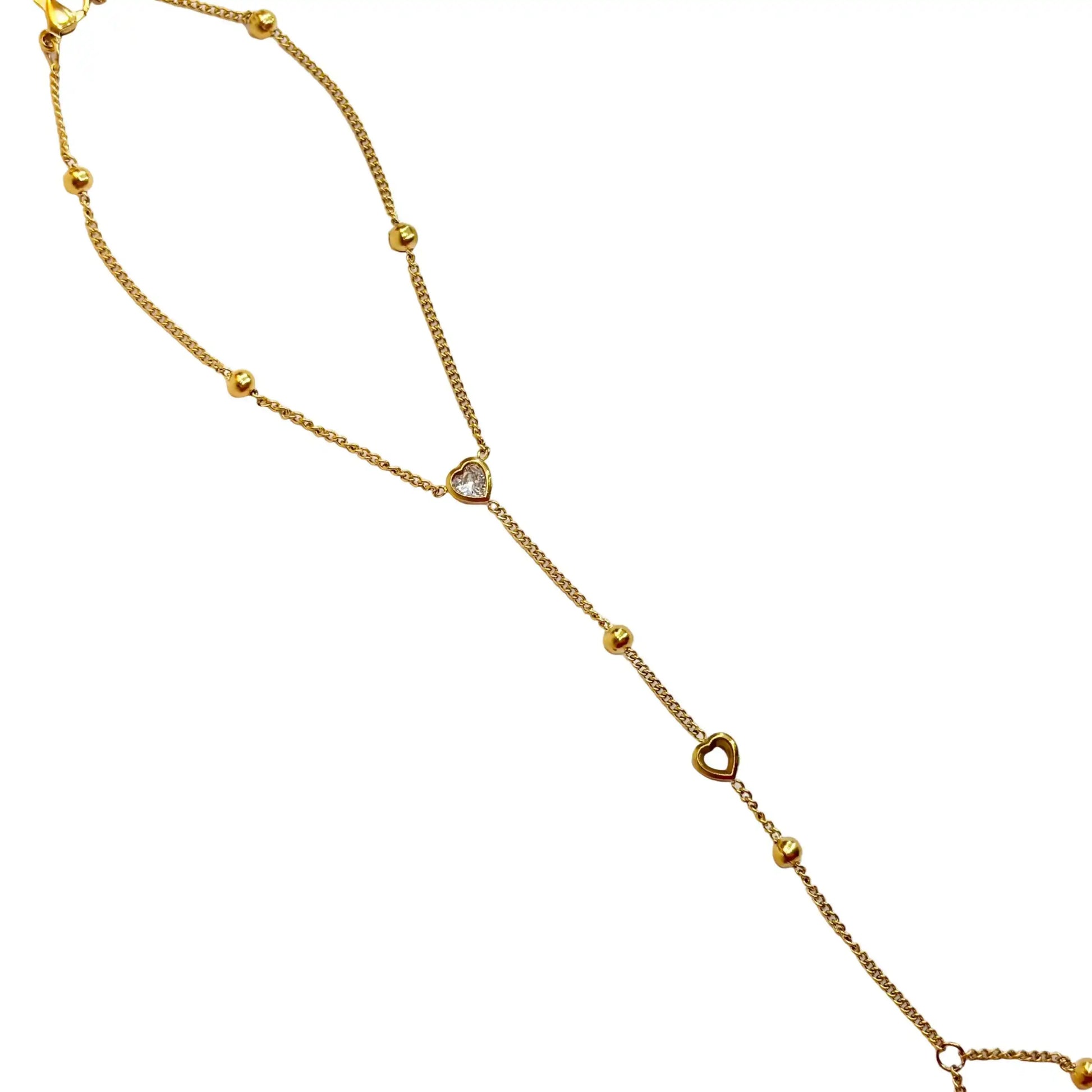 Gold hand chain with diamant heart on a white background