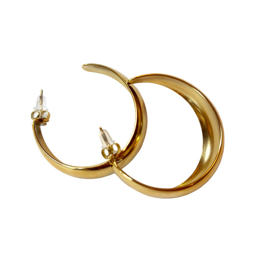 Gold hoop earrings on a white background