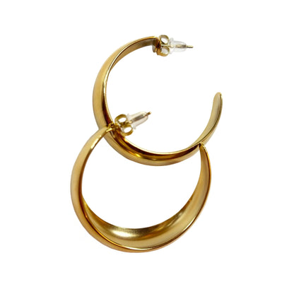 Gold hoop earrings on a white background