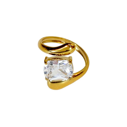 Gold ring with a diamant gemstone on a white background