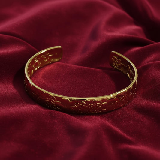 Golden Ivy Embossed Cuff Bracelet 18K on red backround