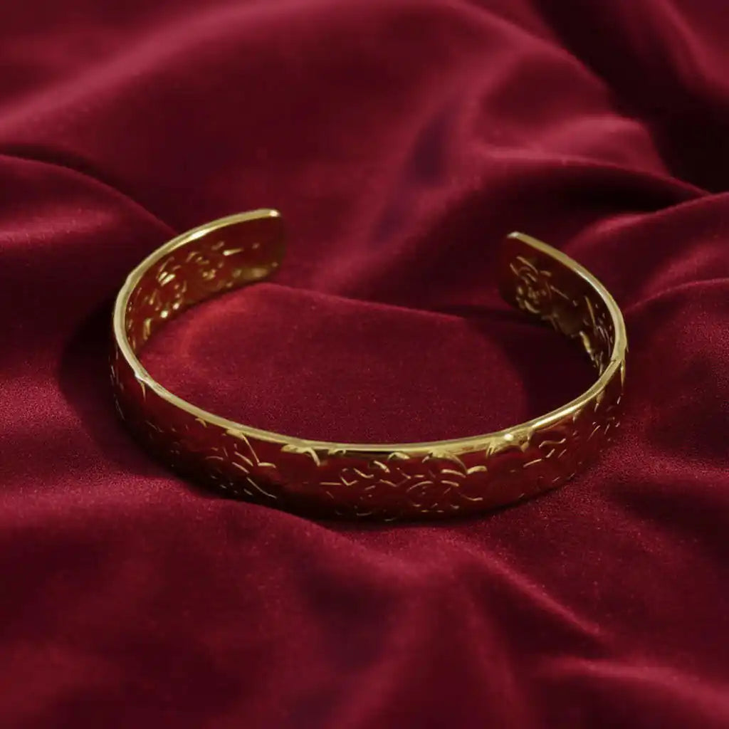 Golden Ivy Embossed Cuff Bracelet 18K on red backround
