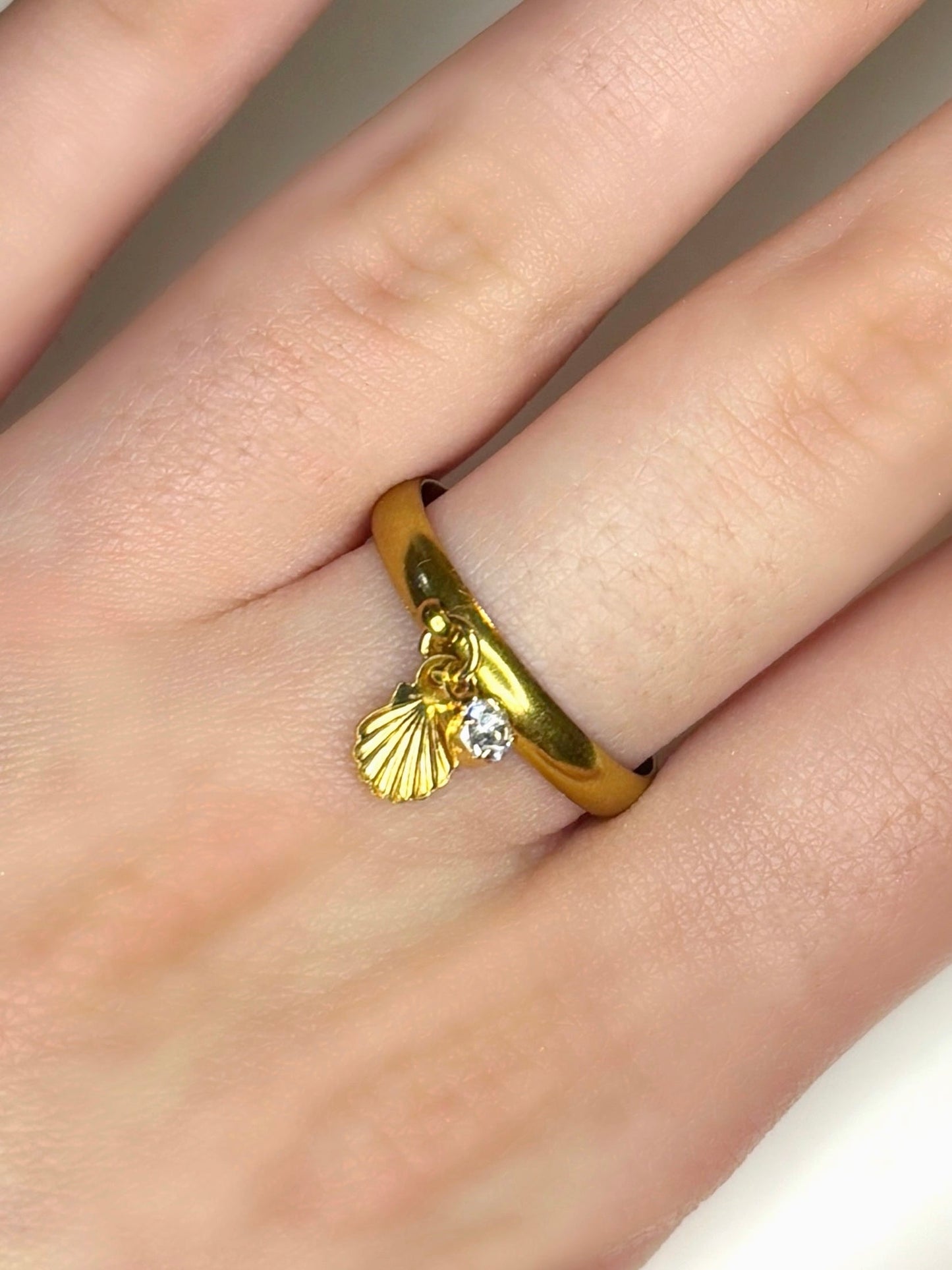 Sea charm gold ring summer stainless steel wearing on model hand